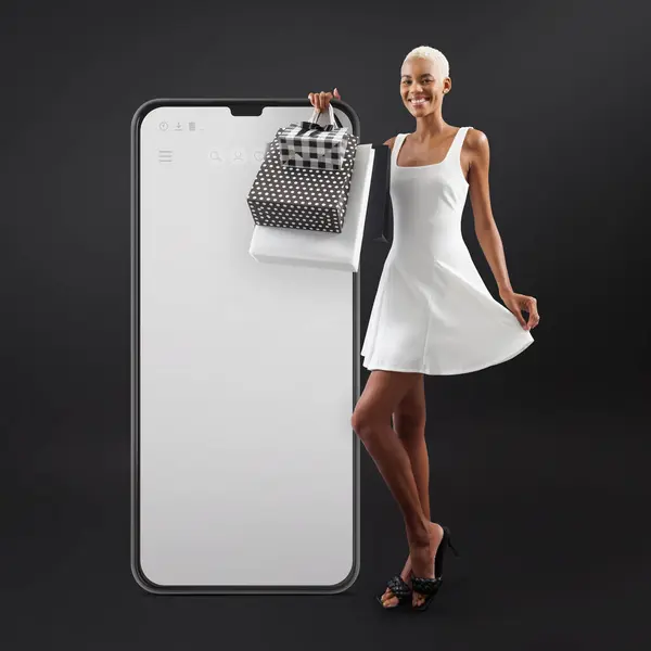 Black Friday shopping online, laughing black woman in white outfit holding bags and showing cell phone with blank screen. Web Store Advertising Guiding Shoppers to sale deals. Isolated on Background