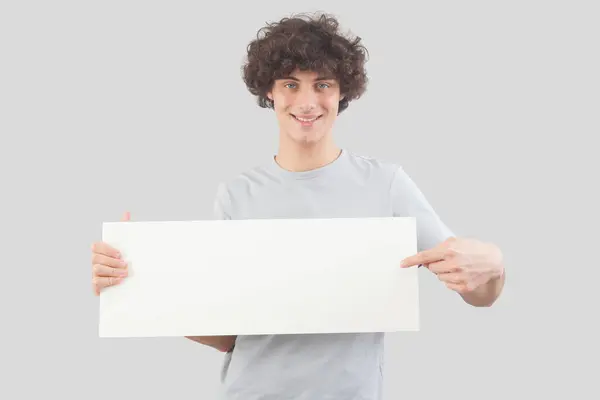 Young Man Smiling Handsome Pointing Finger Show Blank White Signboard Rechtenvrije Stockafbeeldingen