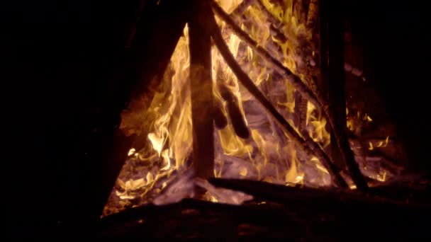 Slow Motion Flaming Chunks Wood Stacked Bonfire Smouldering Embers High — Stock Video