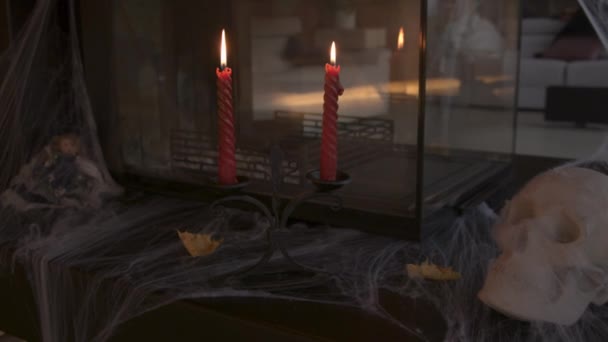 Close Burning Red Candles Cobweb Covered Skull Part Halloween Decor — Stock Video