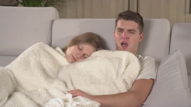 Close Wife Wakes Her Husband Sneezing While Both Rest Couch — Wideo stockowe