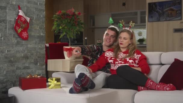 Christmas Couple Enjoying Laughing While Watching Amusing Television Program Cheerful — Stock Video