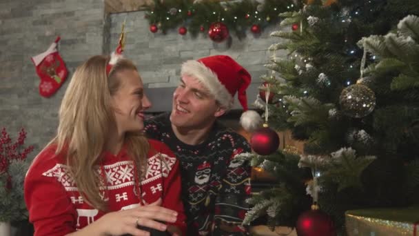 Cheerful Woman Hangs Red Bauble Christmas Tree Man Gives Her — Video Stock
