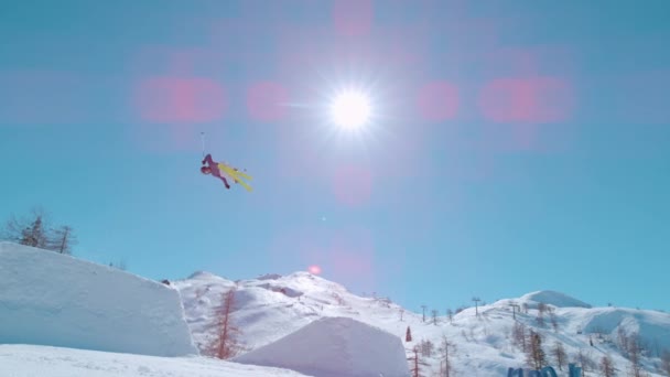 Slow Motion Freestyle Skier Performs Grab Trick While Jumping Big — Vídeo de Stock