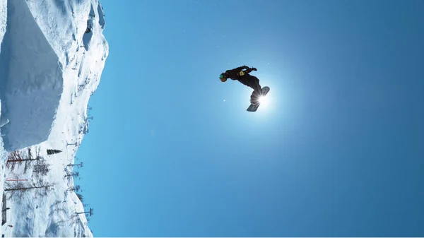 Vertical Lens Flare Man Snowboarding Slovenian Mountains Rides Kicker Does — Stock Photo, Image
