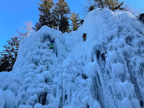 Two Unrecognizable Climbers Ascend Spectacular Frozen Waterfall Gorgeous Slovenian Mountains — Zdjęcie stockowe