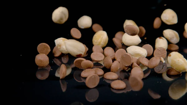 Macro Dof Dry Nut Chocolate Mixture Falling Gliding Surface Black — Photo