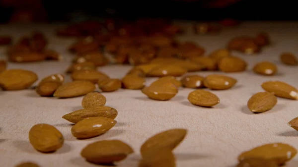 Macro Dof Dried Almonds Glide Wooden Surface Large Industrial Packaging — Stok fotoğraf