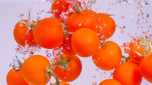 Close Underwater Cinematic Shot Small Tomatoes Falling Splashing Cold Fresh — Stockfoto