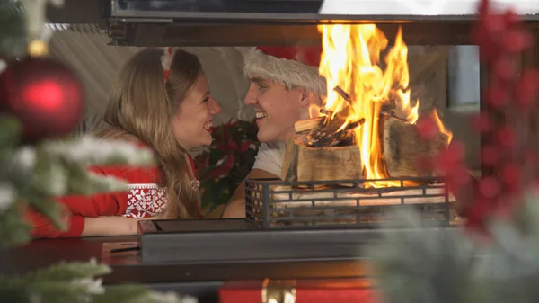 Beautiful Christmas Couple Smiling Each Other While Sitting Fireplace Cheerful — Fotografia de Stock