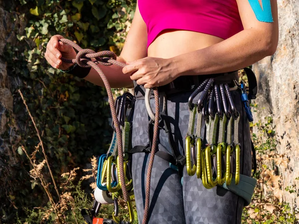 Close Female Rock Climber Making Rope Knot Attachment Climbing Belt 스톡 사진