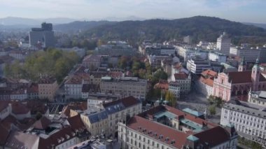 AERIAL: Flying above pretty old town of Ljubljana in Slovenia. Renaissance architecture in medieval European city. 