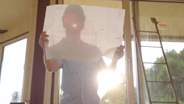 Slow Motion Lens Flare Close Real Estate Investor Compares Architect — Wideo stockowe