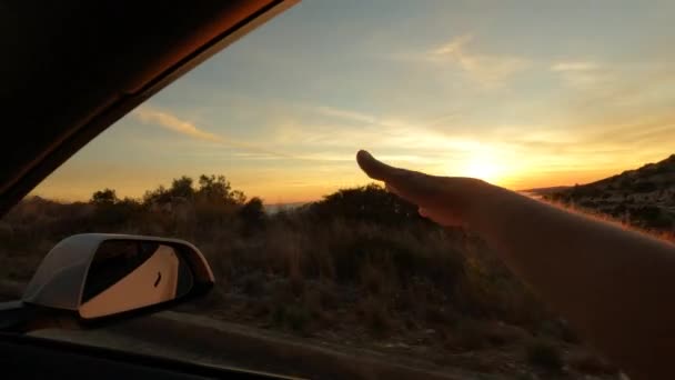 Lens Flare Woman Hand Waves Window Car Driving Seashore She — Stock Video
