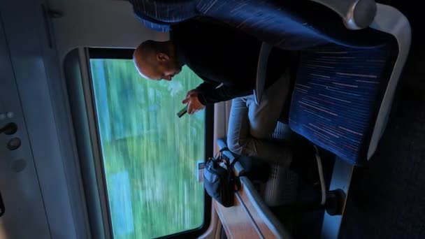 Young Man Sitting Browsing His Smartphone While Traveling Train Work — Stock Video