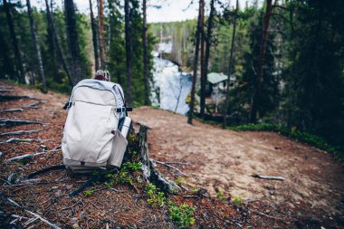 Touristic Backpack of hiker on ground in fall forest in Finland