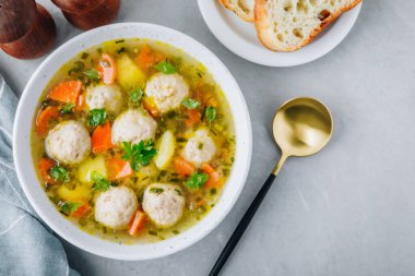 Meatballs soup. Chicken turkey vegetables meatballs soup with carrots and potatoes. Top view, copy space