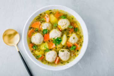 Meatballs soup. Chicken turkey vegetables meatballs soup with carrots and potatoes. Top view, copy space