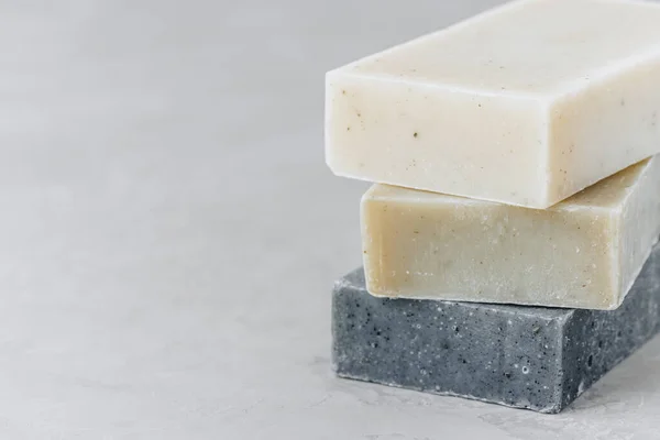 Stock image Soap. Organic soap bars. Stack of natural soap bars on gray stone background, copy space.