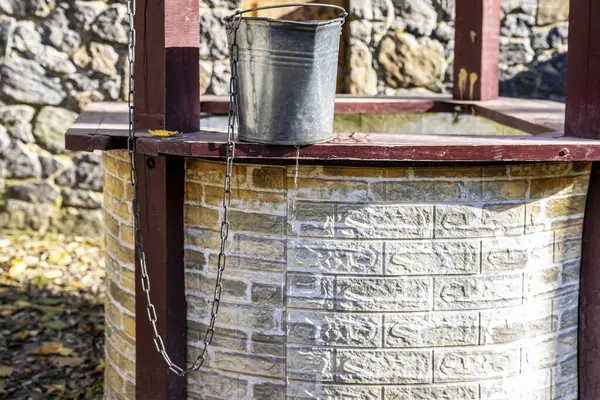 Leaky Metal Bucket Water Flows Well — Stock Photo, Image