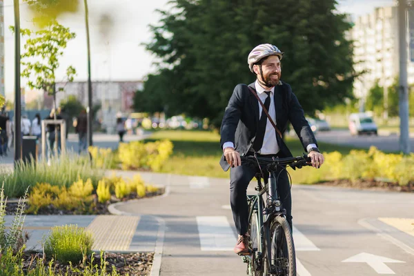 Cheerful Employee Suit Tie Looking Away While Riding Work Bike Obrazy Stockowe bez tantiem
