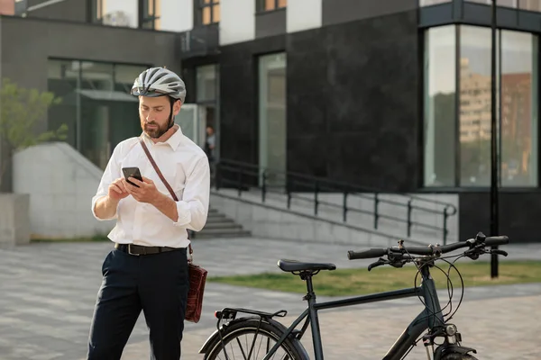 Serious Young Manager Bike Surfing Internet Smartphone While Standing Street Telifsiz Stok Imajlar