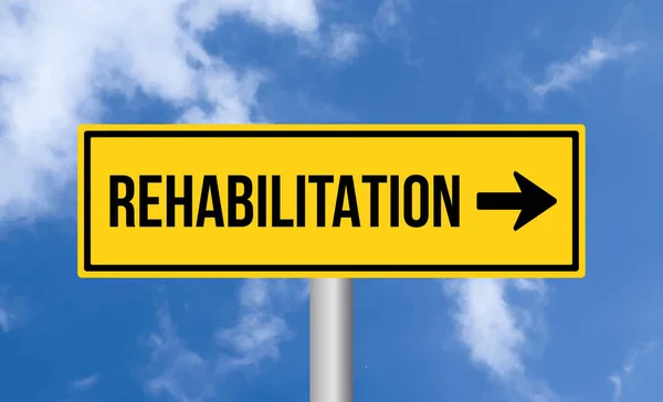 Stock image Rehabilitation road sign on blue sky background