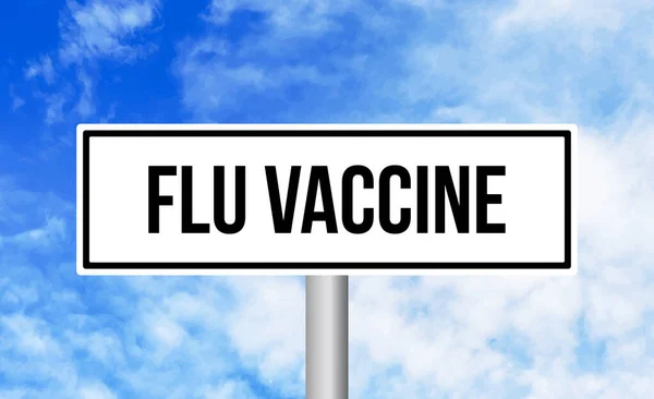 インフルエンザワクチン道路標識上の空の背景 — ストック写真