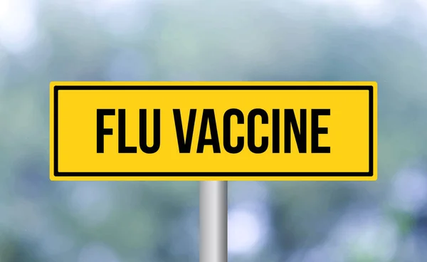 インフルエンザワクチン道路標識上のぼかしの背景 — ストック写真