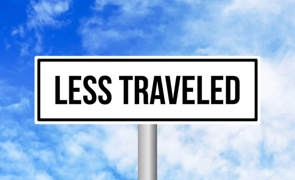 Less Traveled Road Sign Blue Sky Background — Stock Photo, Image