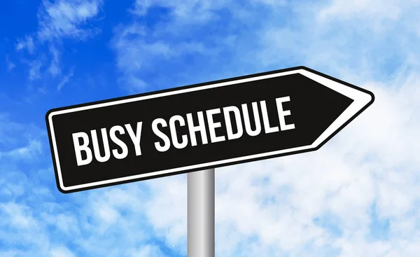 stock image Busy schedule road sign on blue sky background