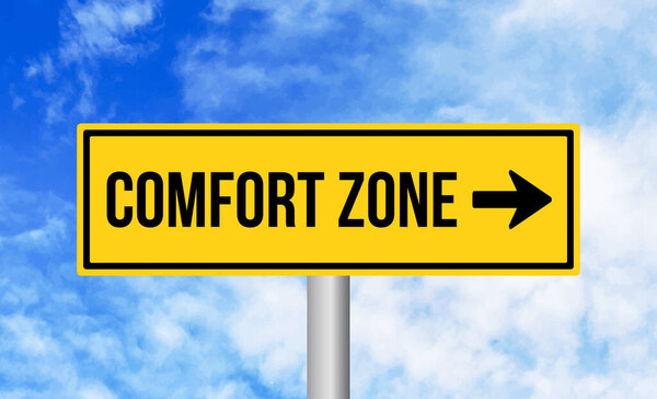 Comfort zone road sign on cloudy sky background