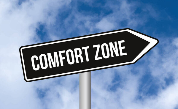 Comfort zone road sign on cloudy sky background