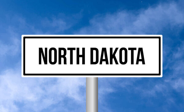 North dakota road sign on blue sky background