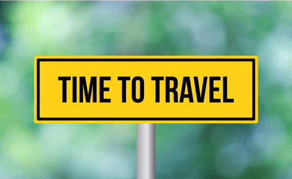 Time to travel road sign on blur background