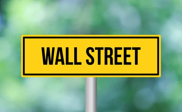 stock image Wall street road sign on blur background