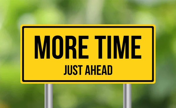 stock image More Time just ahead road sign on blur background