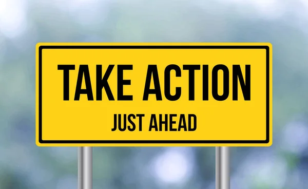 Take Action Just Ahead Road Sign Blur Background — Stock fotografie