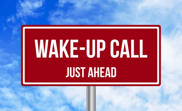 stock image Wake up Call just ahead road sign on cloudy sky background