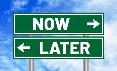 Now or later road sign on sky background clipart