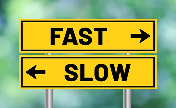 stock image Fast or slow road sign on blur background