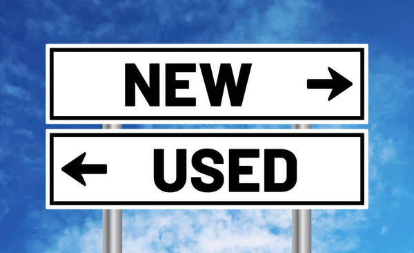 New or used road sign on cloudy sky background