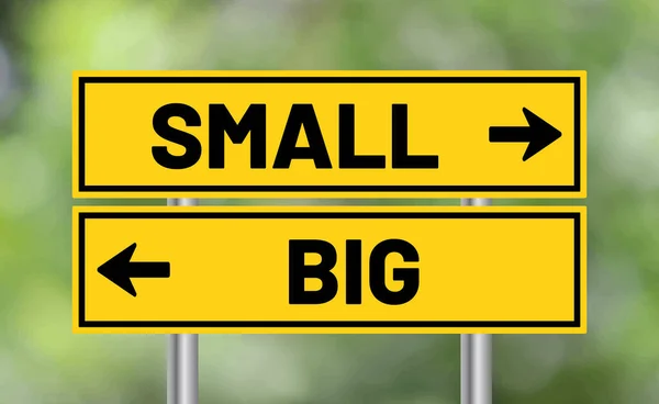 stock image Small or big road sign on blur background