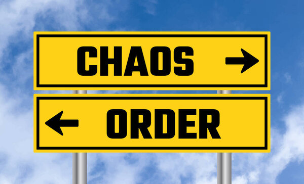Chaos or order road sign on sky background