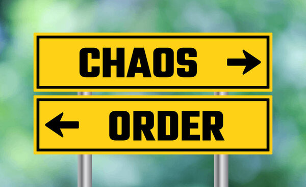 Chaos or order road sign on blur background