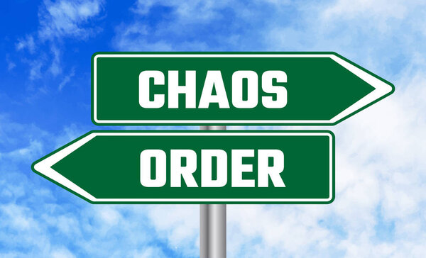 Chaos or order road sign on sky background