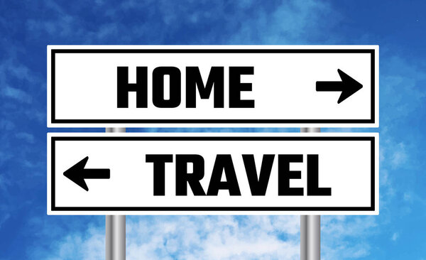 Home or travel road sign on sky background