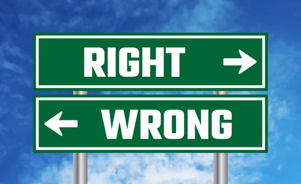 stock image Right or wrong road sign on blue sky background