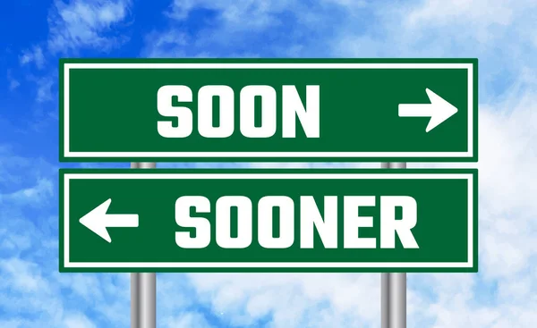 stock image Soon or sooner road sign on blue sky background