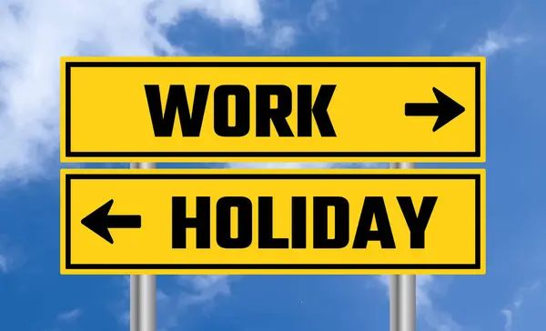 stock image Work or holiday road sign on cloudy sky background